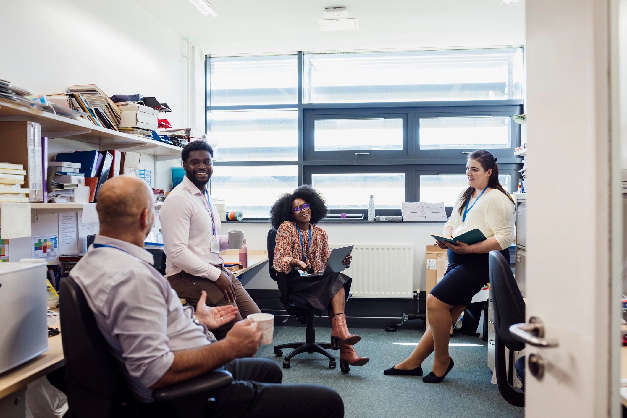 Community-focused team gathered together in conversation
