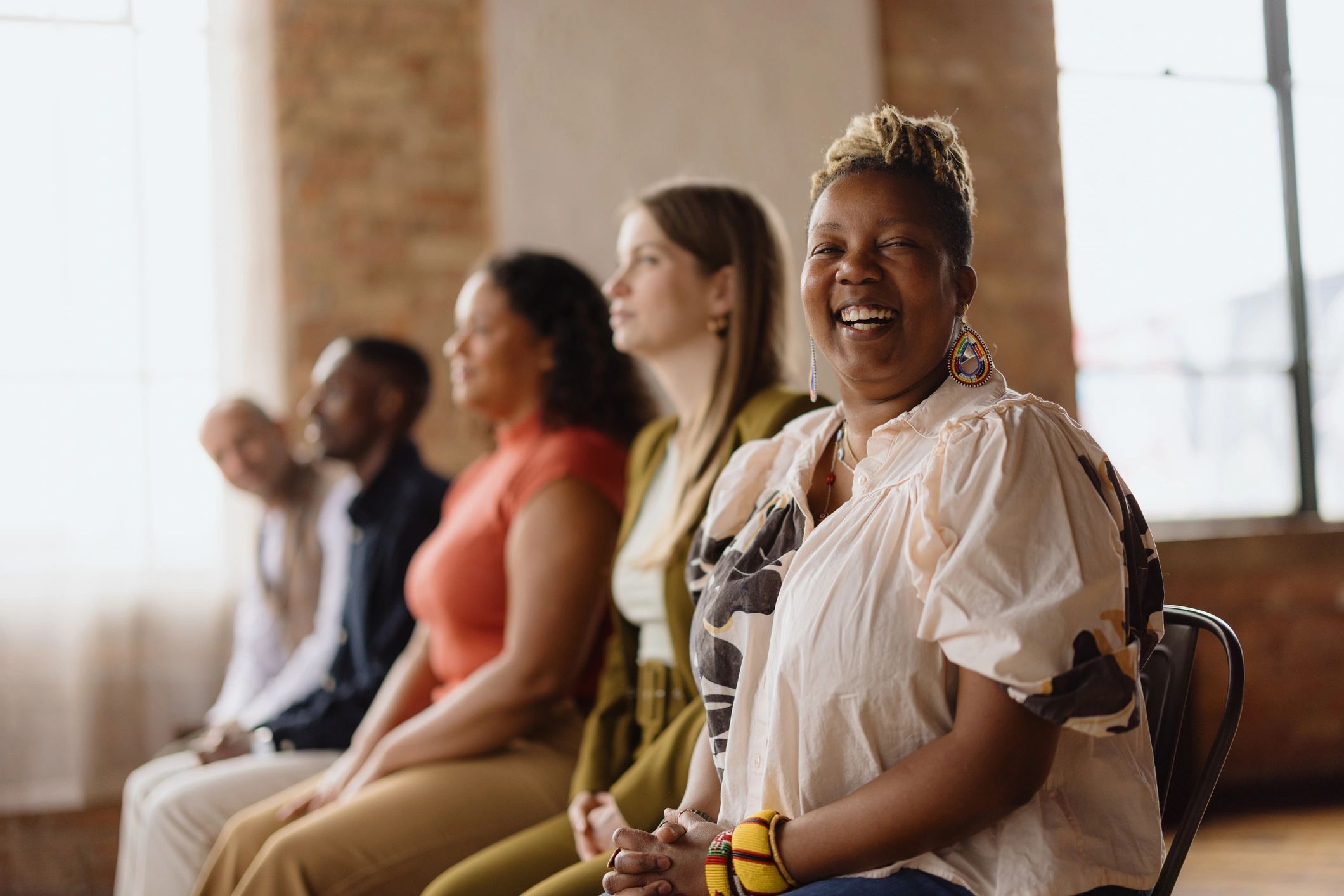 Entrepreneurs collaborating during a community meeting