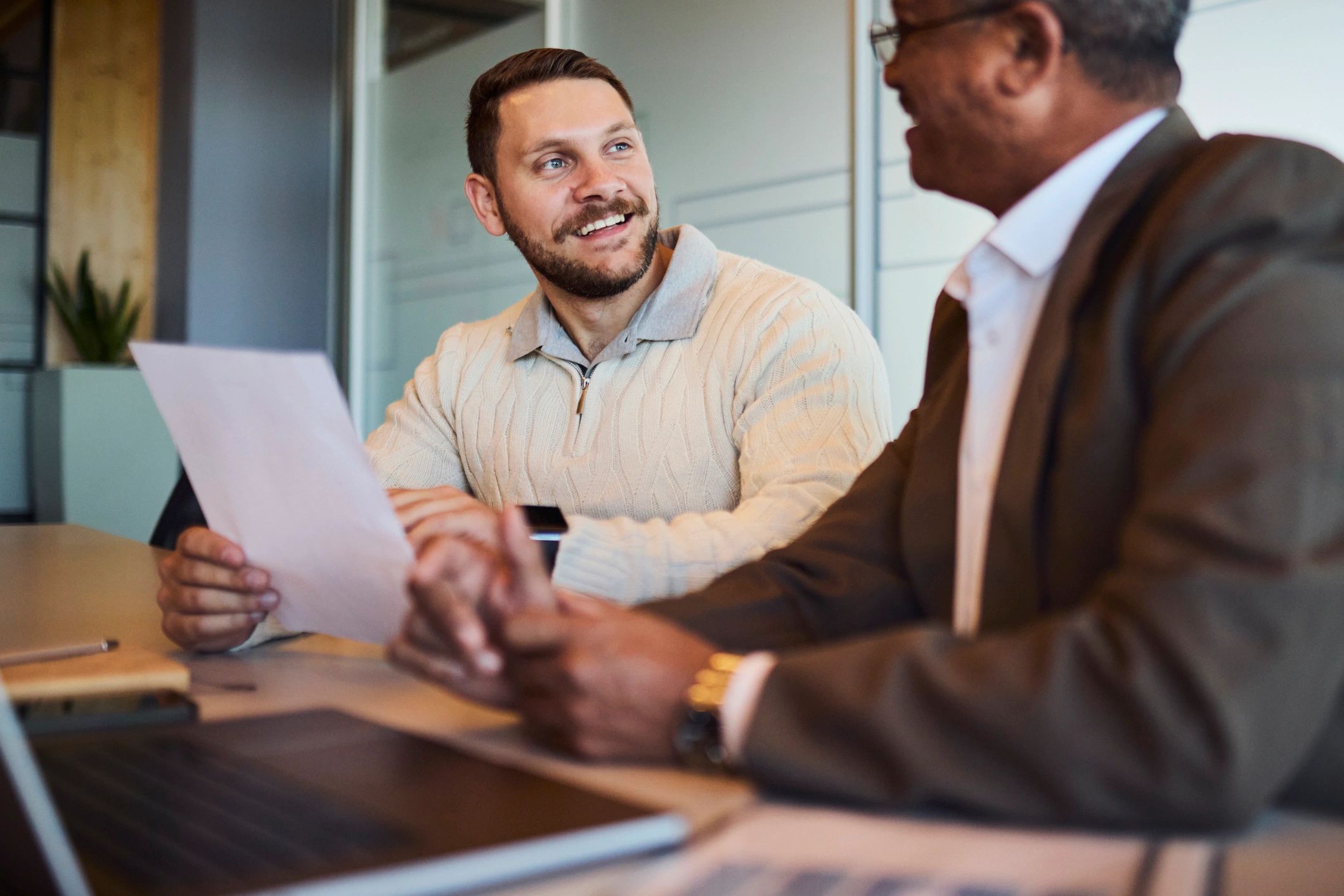 Entrepreneur reviewing paperwork with a mentor