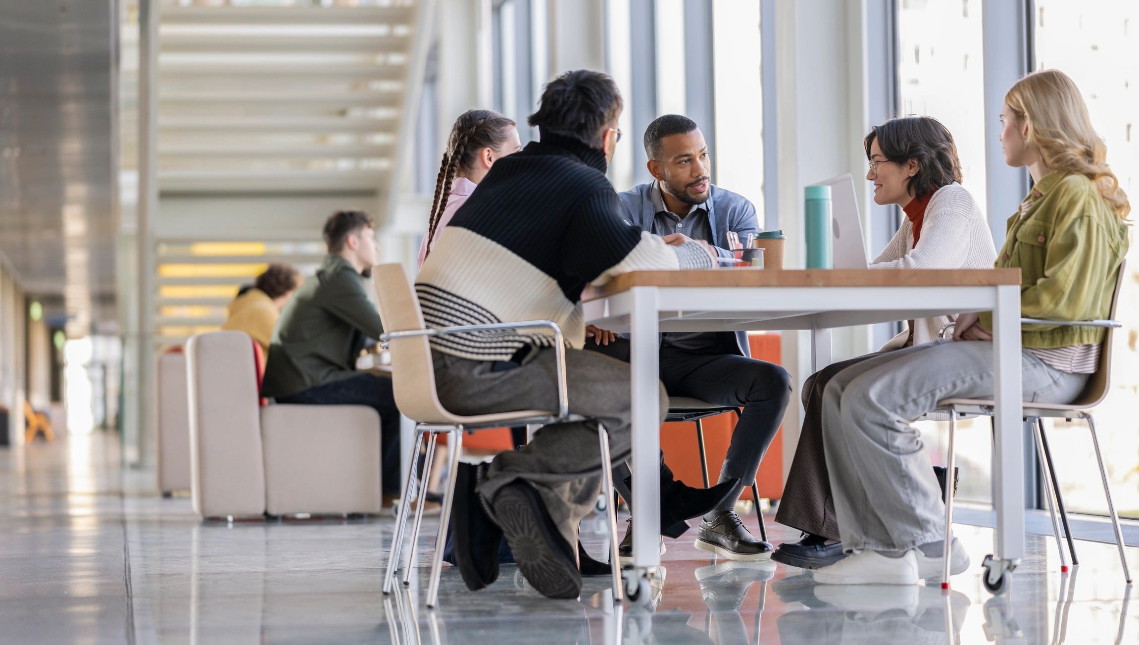 Entrepreneurs brainstorming together in a collaborative office